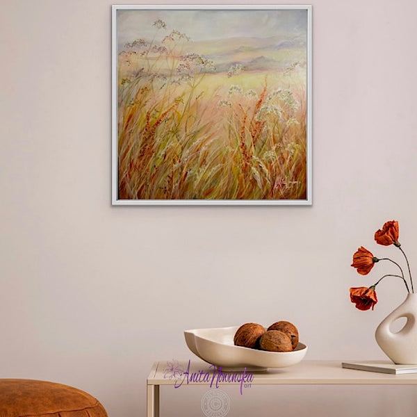 original meadow painting at golden hour by anita nowinska art soft warm tones of peach auburn amber and blue
