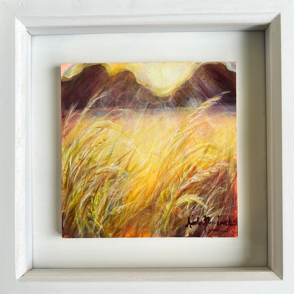 small framed miniature painting of a sunlit grassy meadow in golden hour with dappled sunlight and sunrays  by Anita Nowinska contemporary art