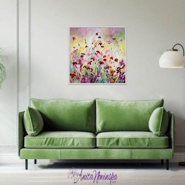 Happy bright flower painting of marigolds & japanese anemones in flower garden meadow by anita nowinska pink gold yellow maroon in living room with green sofa.JPEG