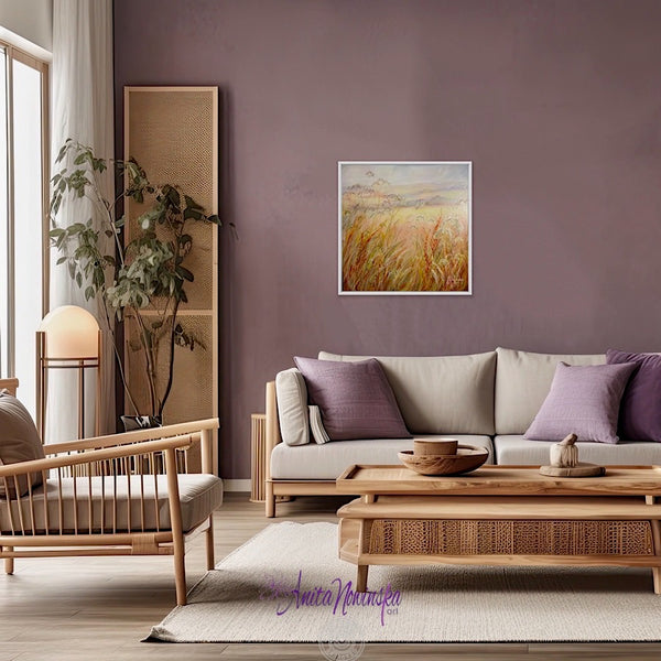 original meadow painting at golden hour by anita nowinska art soft warm tones of peach auburn amber and blue in lilac decor living room interior