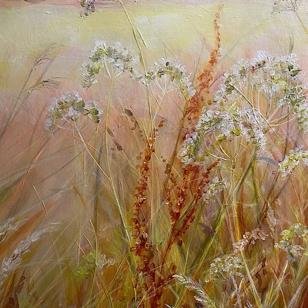 original meadow painting at golden hour by anita nowinska art soft warm tones of peach auburn amber and blue detail