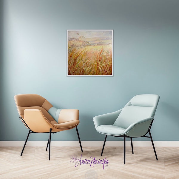 original meadow painting at golden hour by anita nowinska art soft warm tones of peach auburn amber and blue in pale blue interior decor