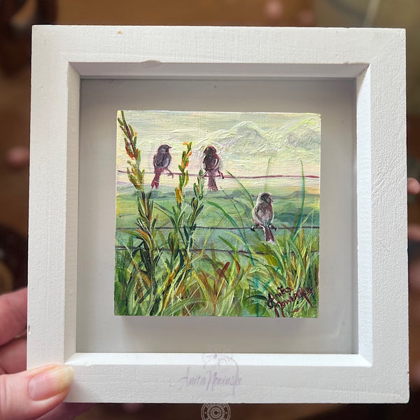 three little birds is a miniature oil painting of three sparrows sitting on a wore fence surrounded by sunlit grasses