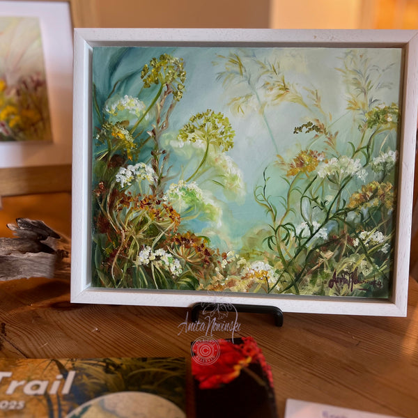 small framed oil painting of wild flowers cow parsley on a blue grey background
