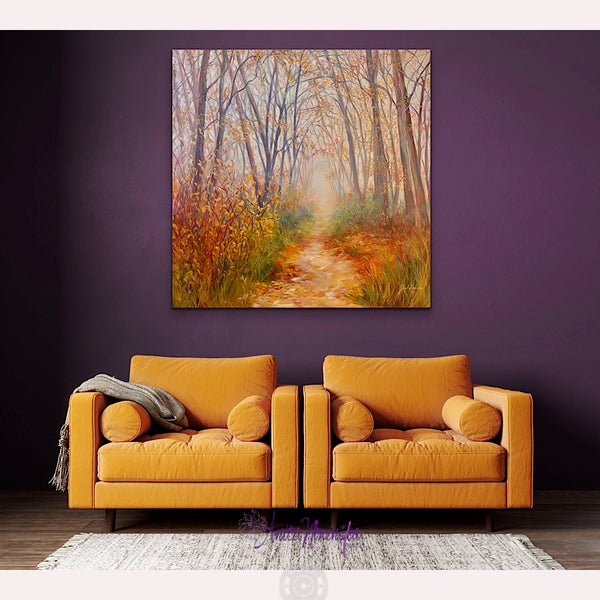 big oil on canvas painting of autumn woods with a misty path leading to light in a room with gold chairs & purple wall