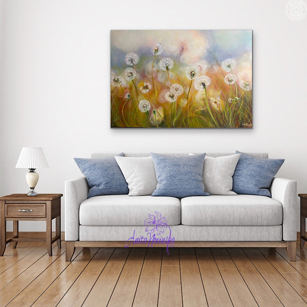 dandelion meadow painting by anita nowinska in room with white & pale blue sofa