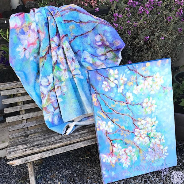 white apple blossom on blue sky & gold leaf, cosy floral throw by Anita Nowinska